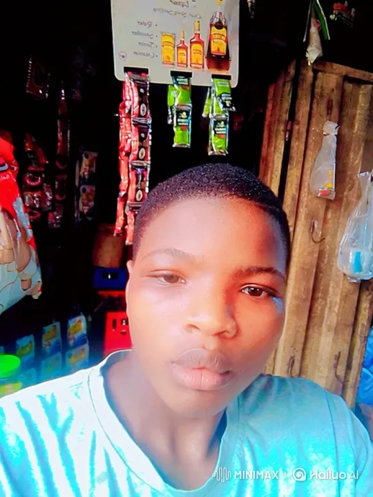 Young Person in a Shop with a Calm, Contemplative Gaze – AI Generated Video | Hailuo AI