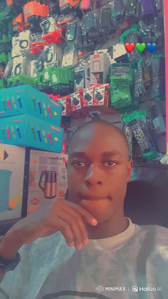 Young Man's Serene Smile in Electronics Store – AI Generated Video | Hailuo AI