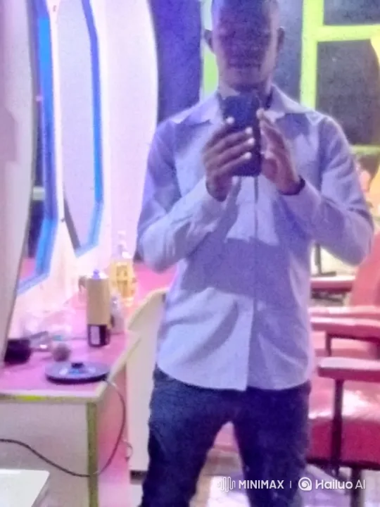 Man Takes Selfie in Vibrant Room, Reviews and Smiles at Reflection – AI Generated Video | Hailuo AI