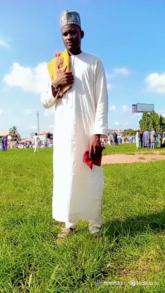 Man in White Stands Confidently by the Electric Truck – AI Generated Video | Hailuo AI