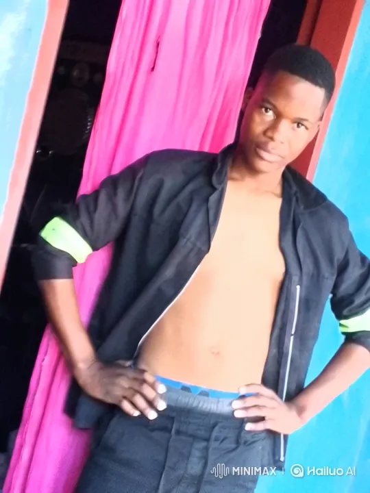 Confident Young Man Poses in Colorful Indoor Setting – AI Generated Video | Hailuo AI