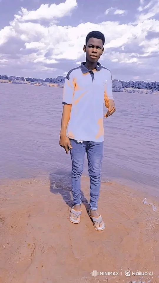 Young Man Reflects by Muddy Water Bank – AI Generated Video | Hailuo AI