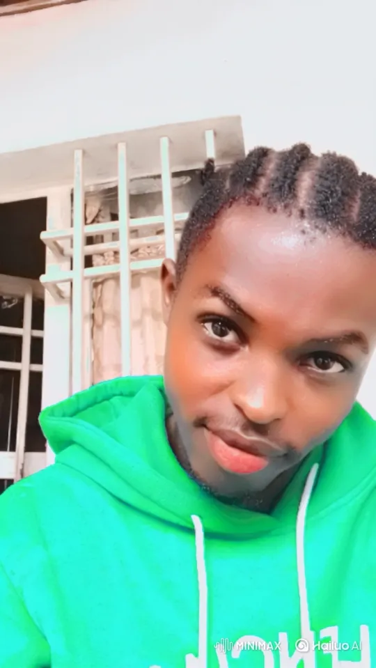 Portrait of a Confident Young Man in a Green Hoodie – AI Generated Video | Hailuo AI