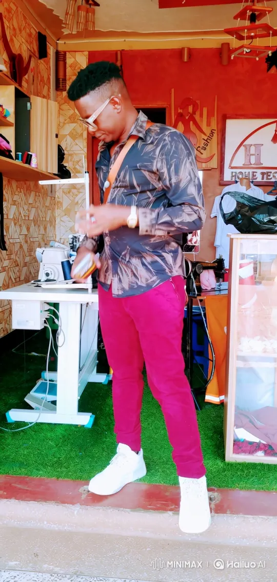 Fashion Designer in Creative Workshop with Satisfied Expression – AI Generated Video | Hailuo AI