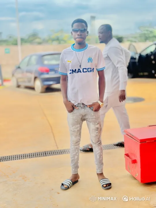Young Man Poses Casually in Tranquil Outdoor Scene – AI Generated Video | Hailuo AI