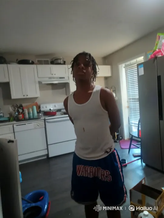 Young Man in Kitchen with Relaxed Posture – AI Generated Video | Hailuo AI
