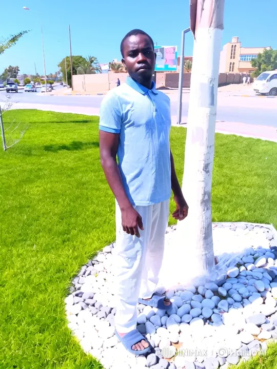 Man in Light Blue Shirt Tracks with Camera in Sunny Setting – AI Generated Video | Hailuo AI