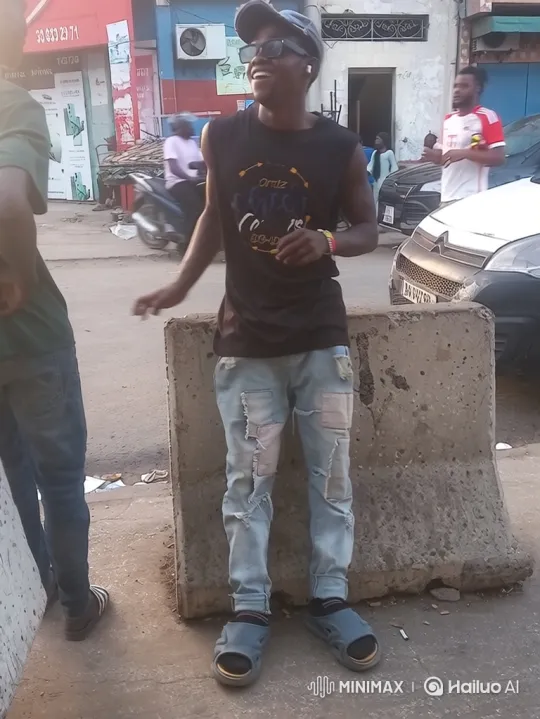 Joyful Young Man Dancing to Music on Chinese Street – AI Generated Video | Hailuo AI