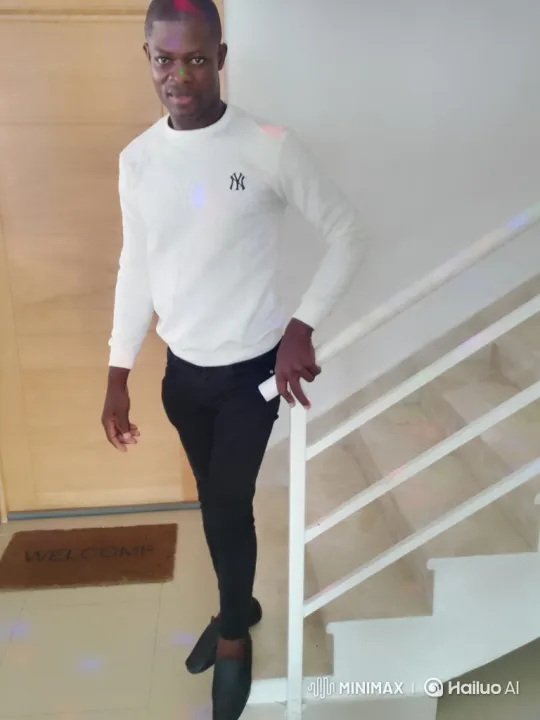 Man Poses, Smiles, and Ascends Stairs in Calm Manner – AI Generated Video | Hailuo AI