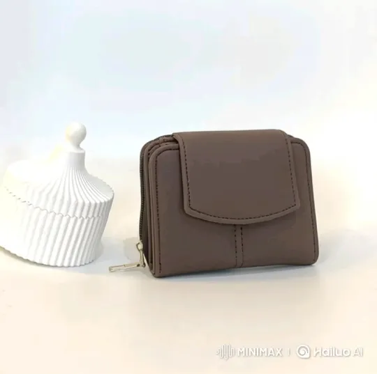 Rotating Close-Up of a Minimalist Taupe Wallet – AI Generated Video | Hailuo AI