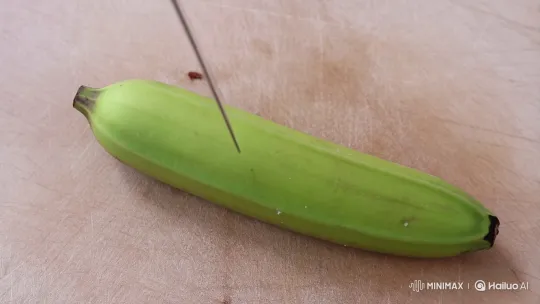 Sharp Knife Slices Green Banana in Close-Up – AI Generated Video | Hailuo AI
