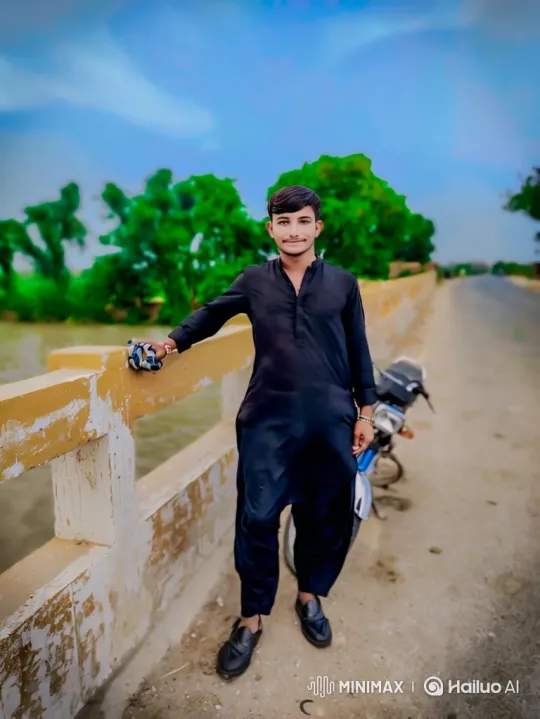 Young Man Enjoying Scenery on Bridge with Motorcycle – AI Generated Video | Hailuo AI