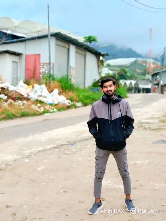 Young Man Stands Confidently in Rural Landscape – AI Generated Video | Hailuo AI