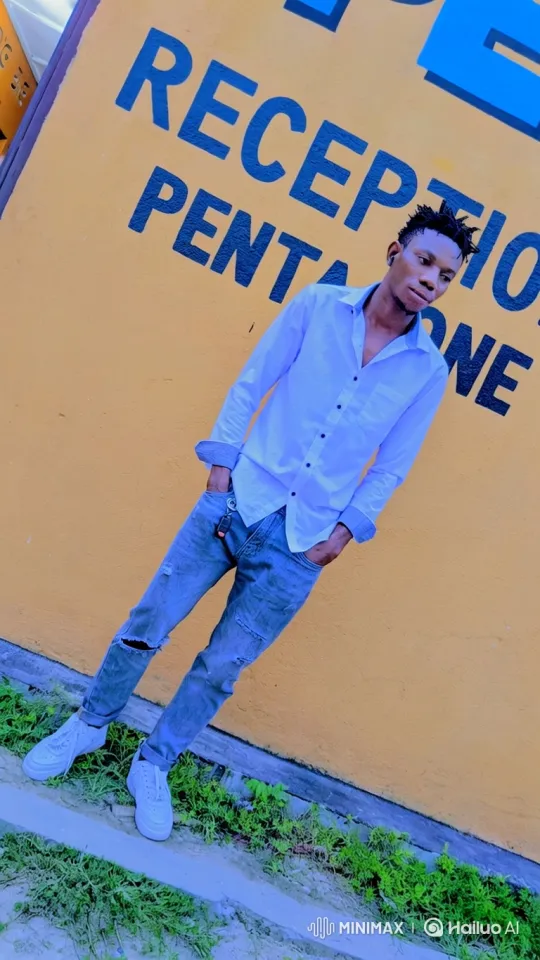 Young Man Poses Thoughtfully Against Bright Wall – AI Generated Video | Hailuo AI