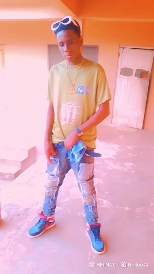 Young Man Poses Confidently in Outdoor Corridor – AI Generated Video | Hailuo AI