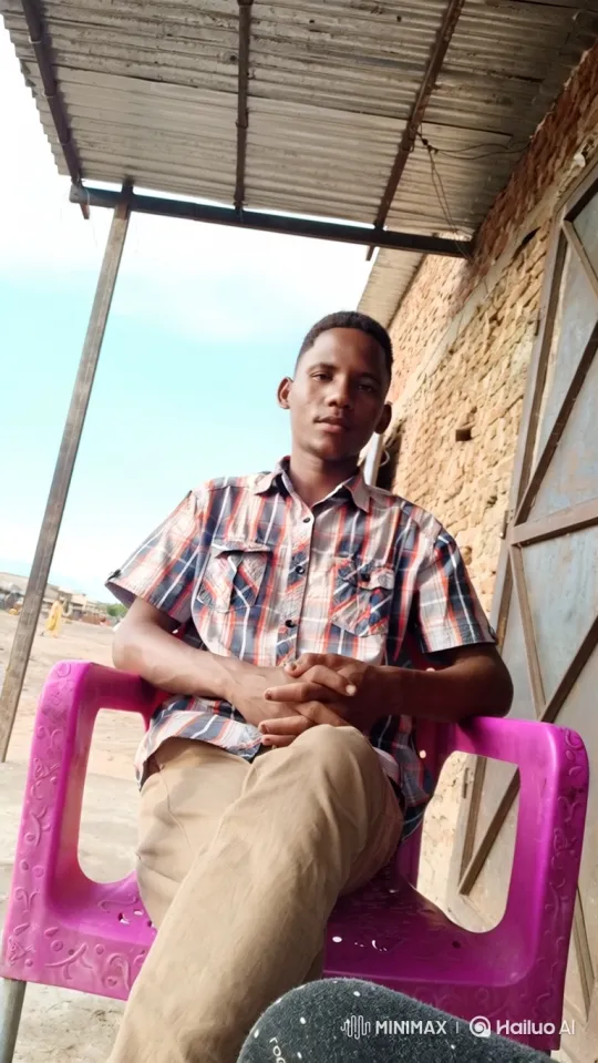 Young Man in Pink Chair: A Study in Calmness – AI Generated Video | Hailuo AI