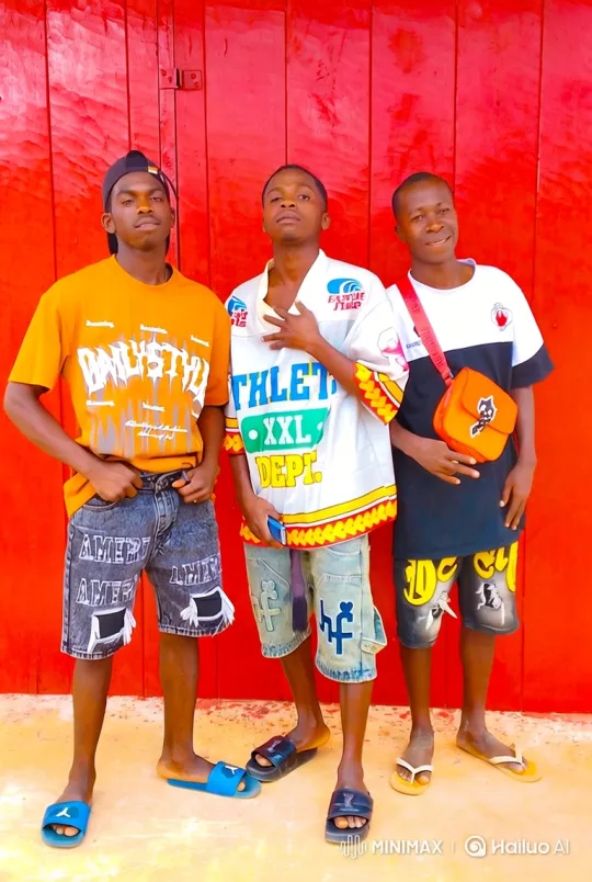 Three Young Men Pose Confidently in Front of Red Wall – AI Generated Video | Hailuo AI