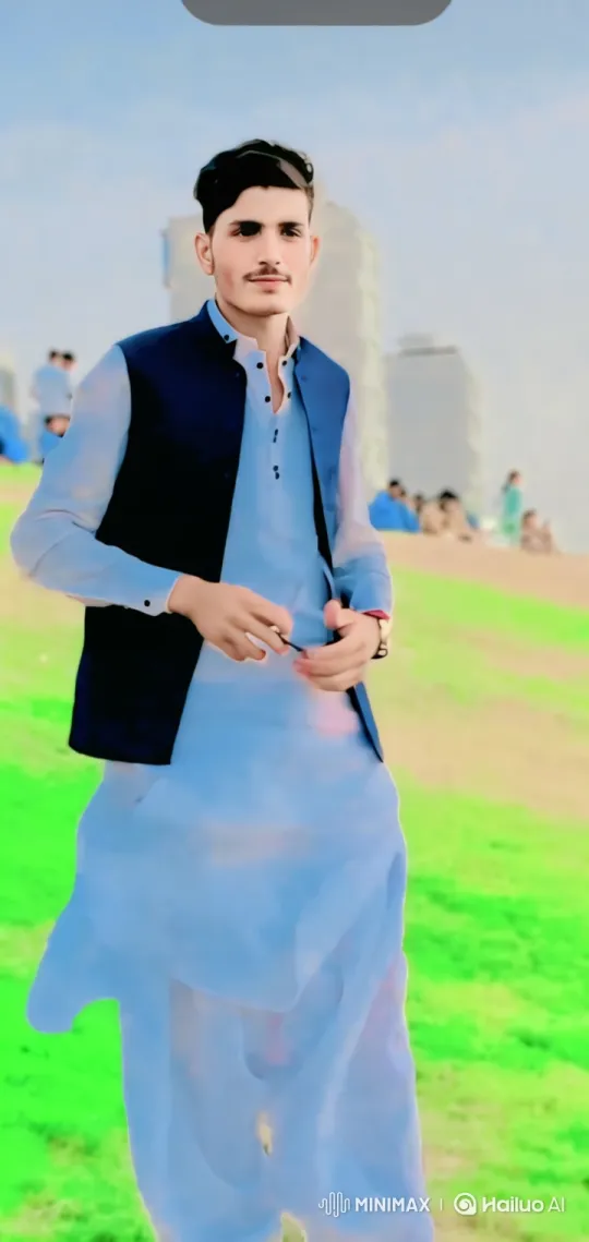 Young Man on Hill: Serene Moment with Gentle Smile – AI Generated Video | Hailuo AI