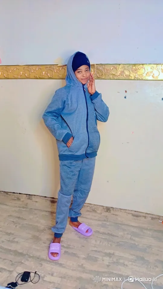 Young Person Poses in Heather Blue Sweatsuit – AI Generated Video | Hailuo AI