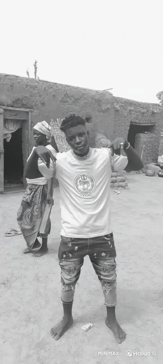 Young Man Poses Confidently in Dirt Courtyard – AI Generated Video | Hailuo AI