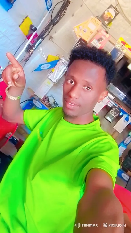 Young Man in Neon Green T-Shirt in Shop Tracking Shot – AI Generated Video | Hailuo AI