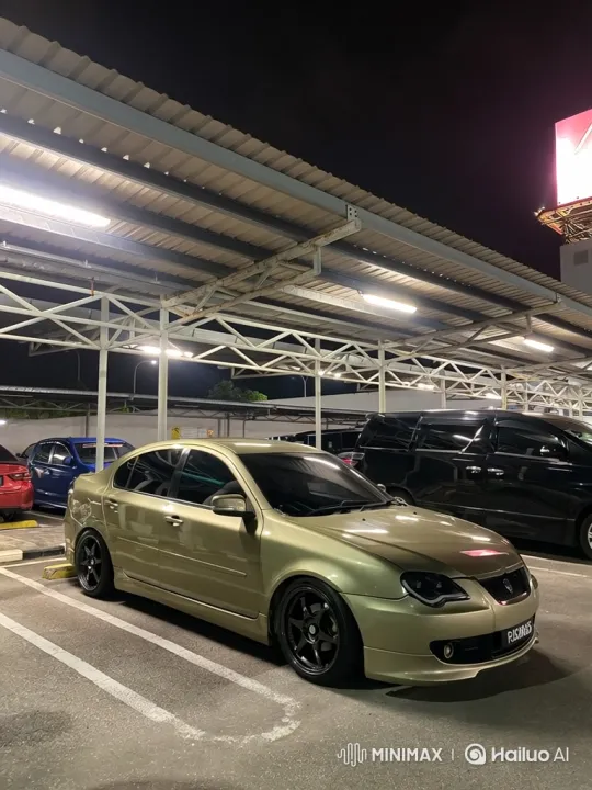Modified Gold Sedan Lowers in Nighttime Parking Lot – AI Generated Video | Hailuo AI