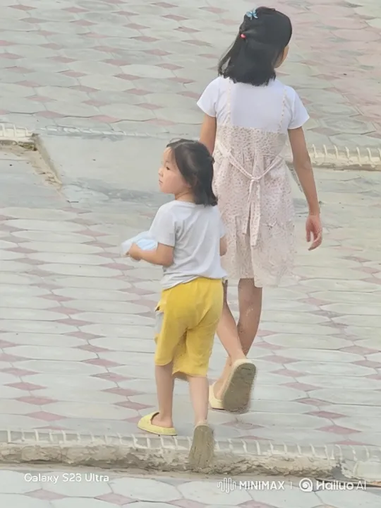 Girls Walking Unhurriedly on Sidewalk Past Car – AI Generated Video | Hailuo AI