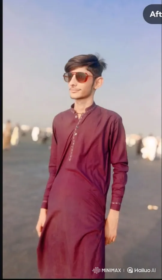 Young Man in Maroon Tunic Enjoys Tranquil Moment Outdoors – AI Generated Video | Hailuo AI