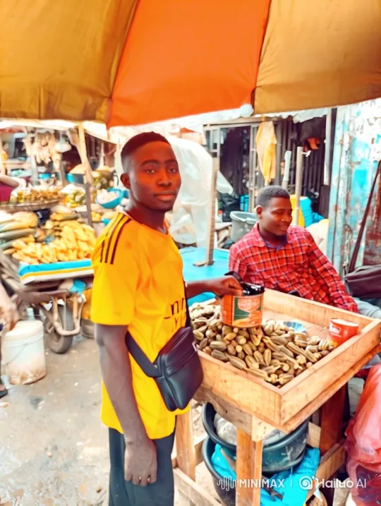 Young Man at Okra Stall in Bustling Market – AI Generated Video | Hailuo AI