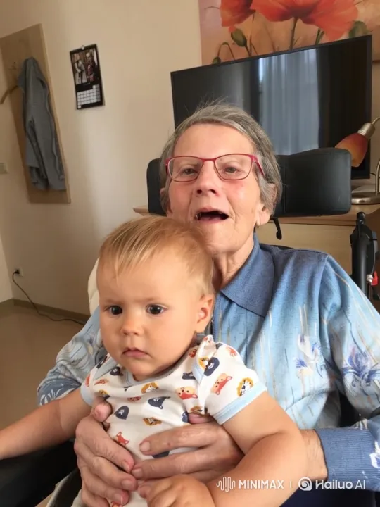 Elderly Woman and Baby Share Moment of Joy – AI Generated Video | Hailuo AI