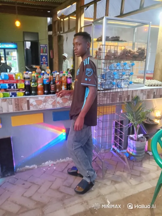 Young Man at Open-Air Stall: Evening Gaze – AI Generated Video | Hailuo AI