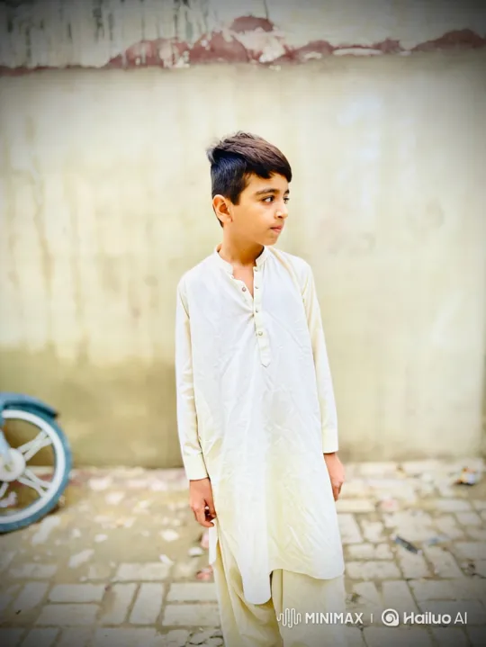 Young Boy Contemplates as He Turns to Camera – AI Generated Video | Hailuo AI