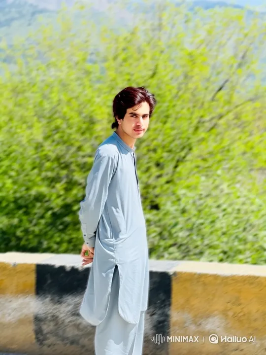 Young Man in Gentle Breeze Amidst Nature – AI Generated Video | Hailuo AI