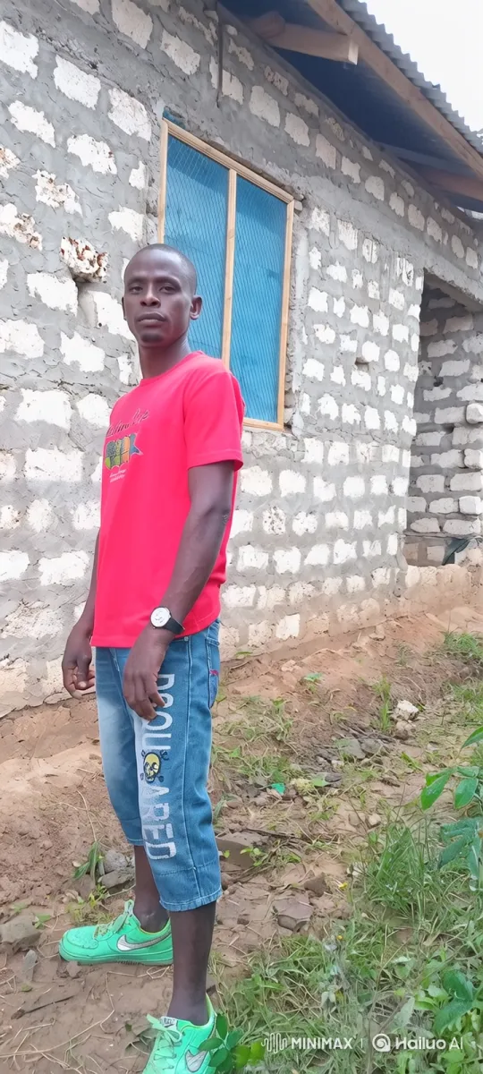 Man Walks Across Dirt Yard with Tracking Camera – AI Generated Video | Hailuo AI