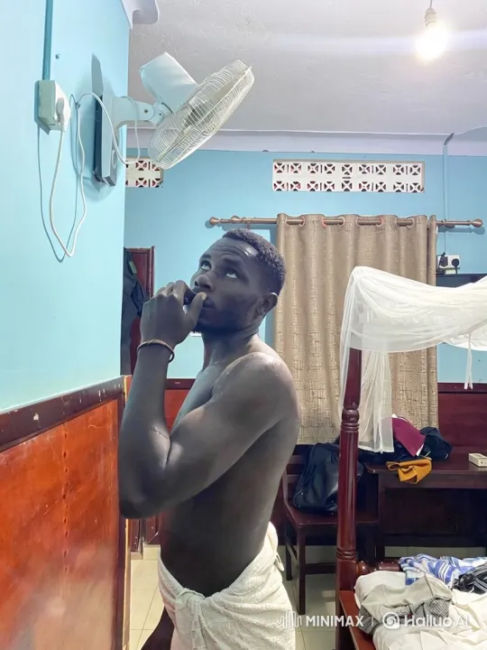 Man Relieved as Fan Starts Blowing Cool Air – AI Generated Video | Hailuo AI