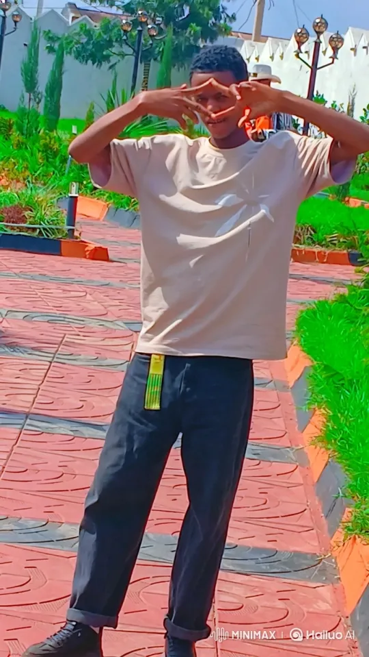 Young Man Smiles Warmly in Sunny Park Setting – AI Generated Video | Hailuo AI