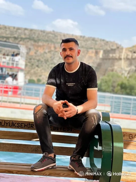 Man on Bench: Nostalgic Afternoon by Water – AI Generated Video | Hailuo AI