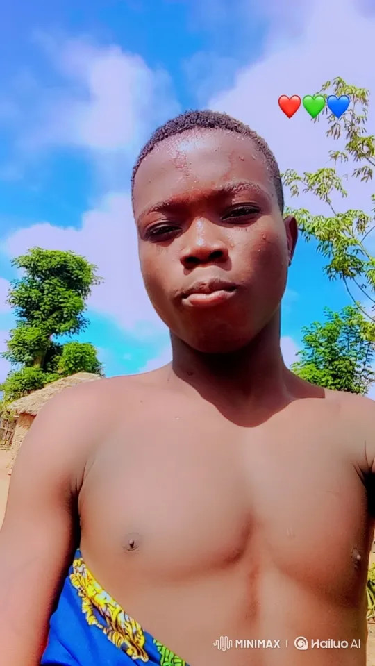 Young Man Smiles Gently in Sunny Outdoor Scene – AI Generated Video | Hailuo AI