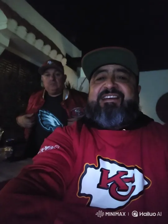 Man in Chiefs Sweatshirt Catches Football in Fantasy Sequence – AI Generated Video | Hailuo AI