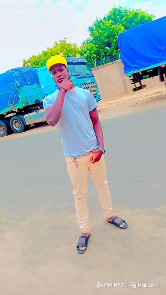 Young Man Stands Calmly in Front of Trucks – AI Generated Video | Hailuo AI