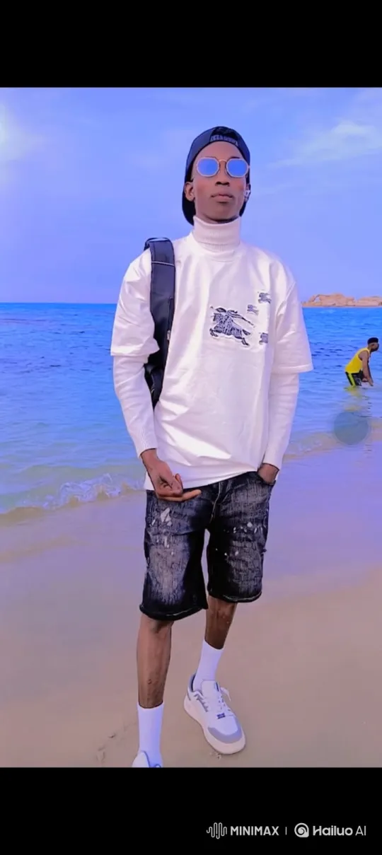 Young Man on Beach in Serene Coastal Setting – AI Generated Video | Hailuo AI