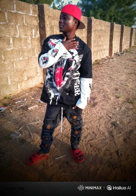 Young Man in Thoughtful Pose Amidst Gentle Breeze – AI Generated Video | Hailuo AI