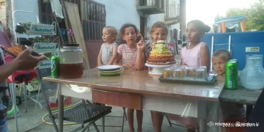 Outdoor Birthday Party: Children Dancing Around Cake – AI Generated Video | Hailuo AI