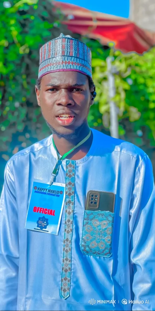 Young Man in Traditional Attire Smiles at Camera – AI Generated Video | Hailuo AI