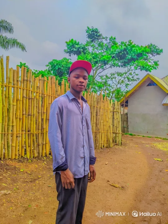 Young Man on Dirt Path with Bamboo Fence Background – AI Generated Video | Hailuo AI