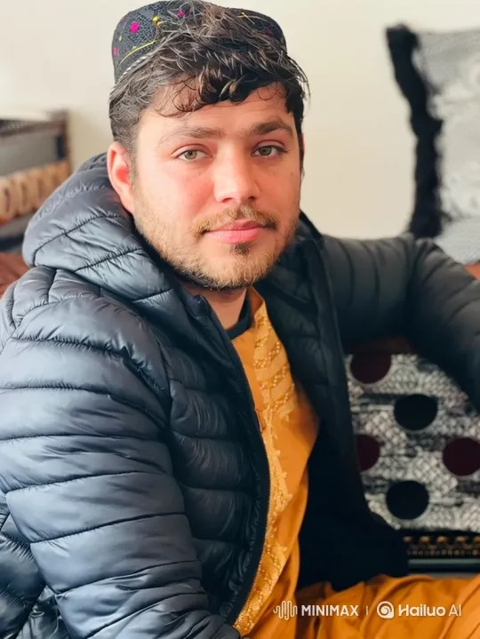 Young Man in Embroidered Jacket with Calm, Soft Expression – AI Generated Video | Hailuo AI