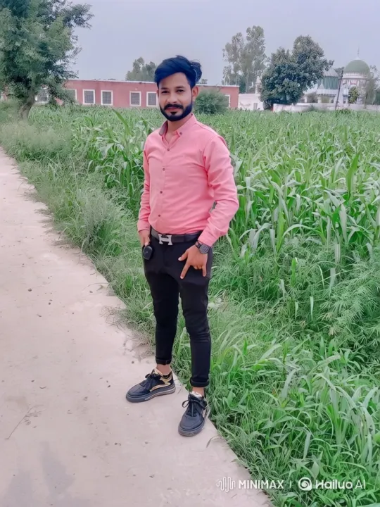 Confident Young Man Poses on Dirt Path Amidst Green Fields – AI Generated Video | Hailuo AI