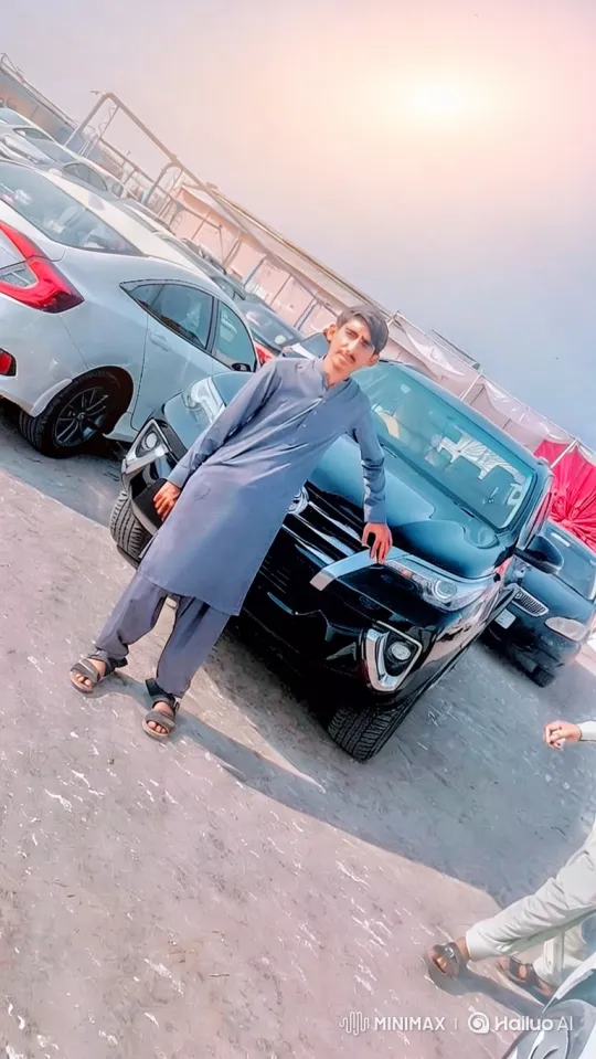 Young Man Enters Black SUV in Open-Air Car Lot – AI Generated Video | Hailuo AI