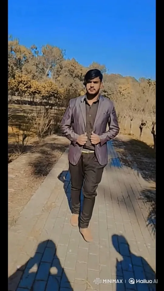 Confident Young Man Walks Towards Camera in Park – AI Generated Video | Hailuo AI
