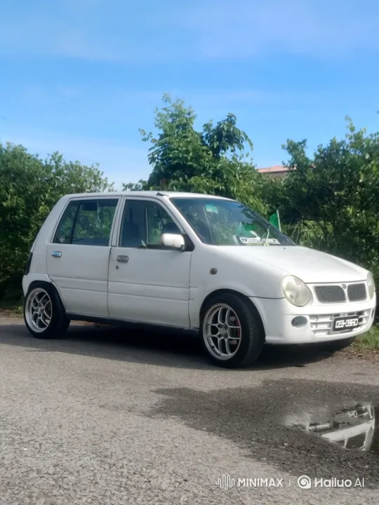 White Hatchback Showcases Modified Suspension Lowering Effect – AI Generated Video | Hailuo AI